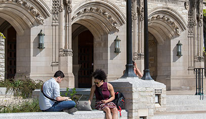 students in front of library